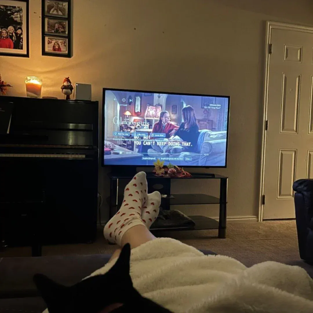 Cozy living room with feet up, watching TV